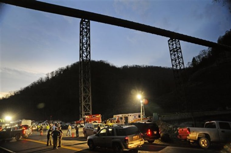 FILE - In an April 5, 2010 file photo, West Virginia State Police direct traffic at the entrance to Massey Energy's Upper Big Branch Coal Mine in Montcoal, W.Va.  An independent investigation concludes the West Virginia coal mine explosion that killed 29 men last year was the result of safety failings by owner Masey Energy Co and rejects the company?s argument that a sudden gas buildup caused the deadliest U.S. coalfield disaster since 1970. The report released Thursday, May 19, 2011 and commissioned by the state?s former governor said Masey violated basic safety practices, including not ventilating the tunnels enough. It supported the federal government's theory that methane gas mixed with huge volumes of explosive coal dust turned a small fireball into a preventable earth-shattering explosion.  (AP Photo/Jeff Gentner, File)